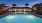 a pool with a building in the background