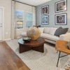 living room with a large window and open spaces